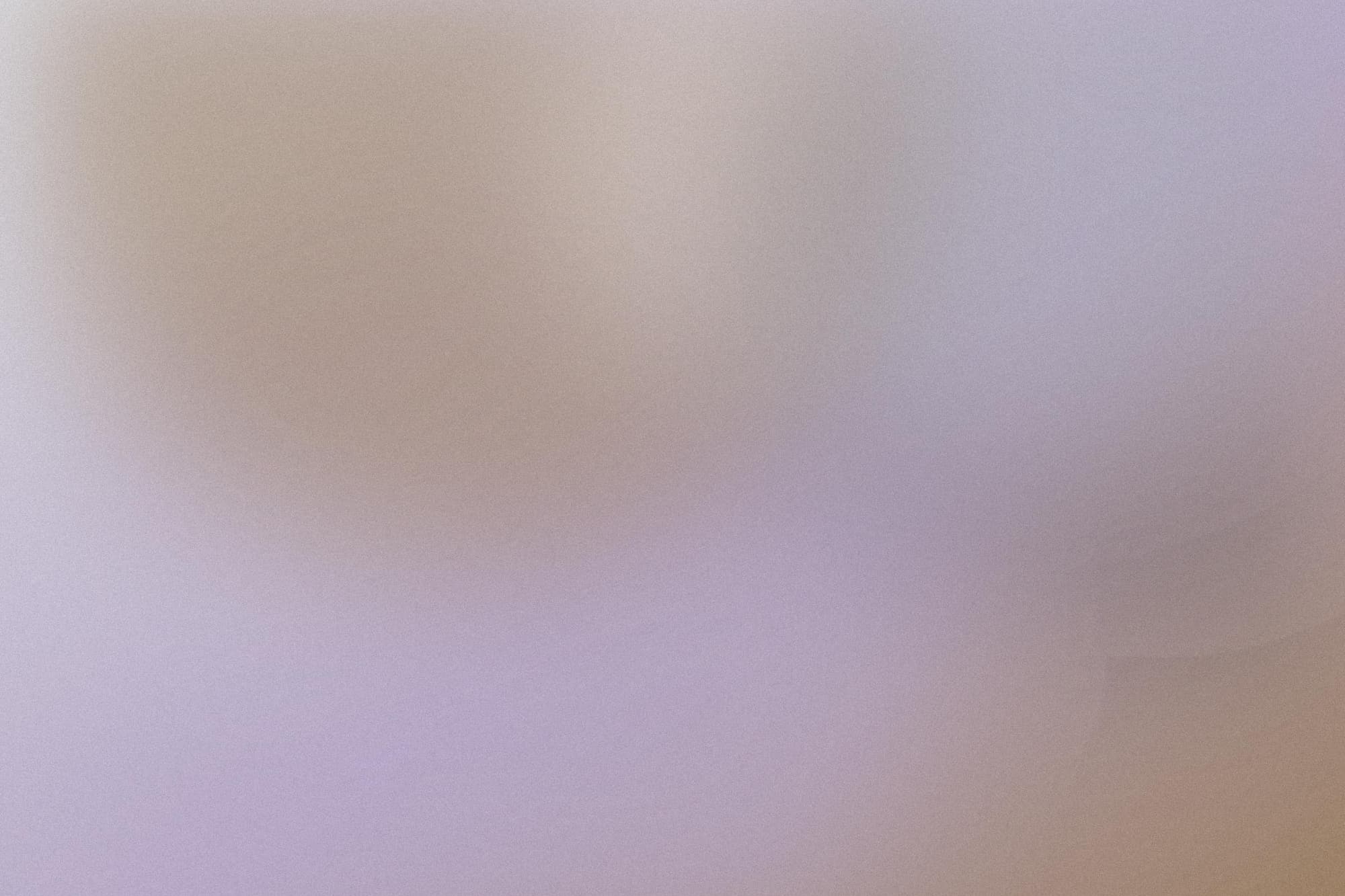 Placeholder still, a pale grey and wood-toned blur